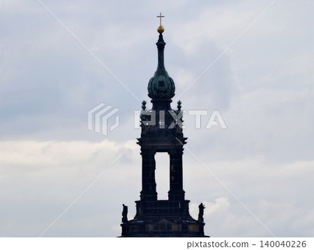 Clock tower inspection. Evaluation of masonry and patina on historic bell tower under cloudy sky 140040226