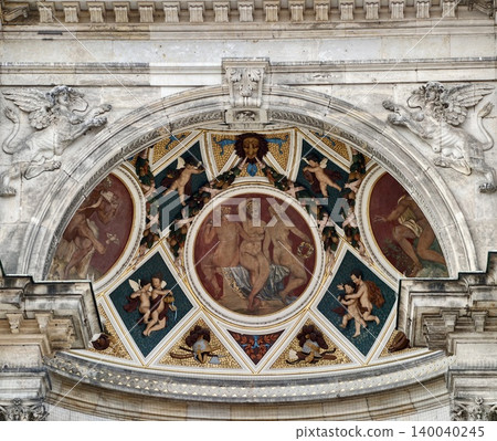 Ornamental semicircular wall panel displaying religious figures with gilded accents and aged restoration marks Ornamental semicircular wall panel displaying religious figures with gilded accents and aged restoration marks 140040245