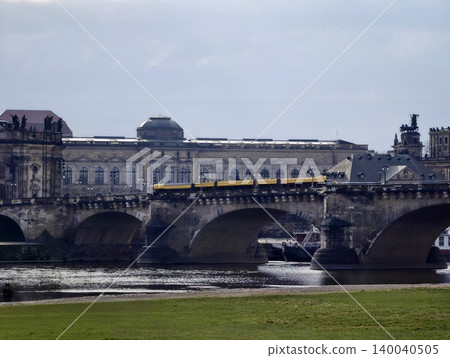 Scenic historic view. Ancient bridge with riverside scene. Panoramic view of historic bridge and river Scenic historic view. Ancient bridge with riverside scene. Panoramic view of historic bridge and river 140040505