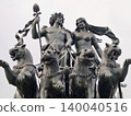 Bronze chariot with horses. Classical bronze sculpture showcasing four horses and allegorical figures 140040516