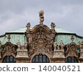 Decorative historic building. Elaborate baroque design with sculpted figures and verdigris patina 140040521