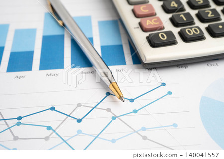 Calculator on chart graph paper. Finance, account, statistic, investment data economy, stock exchange business. Calculator on chart graph paper. Finance, account, statistic, investment data economy, stock exchange business. 140041557