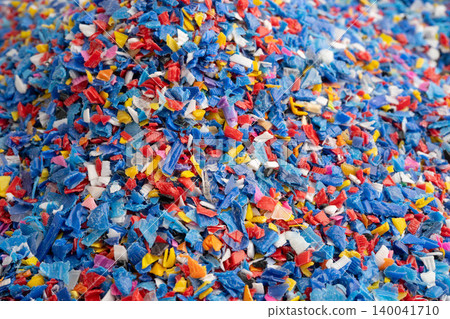 Plastic colorful pieces recycling shredded for industrial use. Plastic colorful pieces recycling shredded for industrial use. 140041710