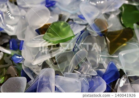 Shimmering, vibrant sea glass imitation, a captivating cascade of smooth, colorful tumbled fragments. Ideal for craft projects, decor, or unique backgrounds Shimmering, vibrant sea glass imitation, a captivating cascade of smooth, colorful tumbled fragments. Ideal for craft projects, decor, or unique backgrounds 140041926