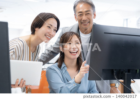 Male and female engineers working in the office 140042017