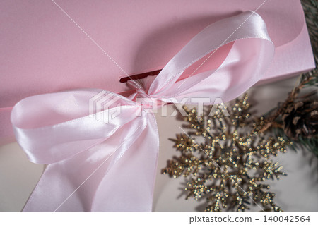 Beautiful gift pink cardboard box stars Christmas balls on beige background top view Flat lay. New Year presents Festive decorations 2024 celebration. Merry Christmas Happy Holidays card Beautiful gift pink cardboard box stars Christmas balls on beige background top view Flat lay. New Year presents Festive decorations 2024 celebration. Merry Christmas Happy Holidays card 140042564