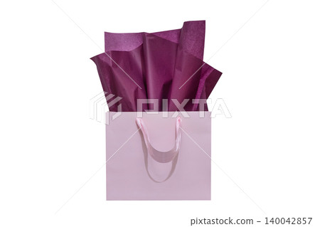 Craft paper gift bag with tissue paper isolated on a white background Craft paper gift bag with tissue paper isolated on a white background 140042857