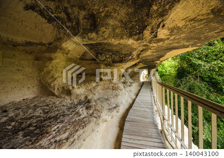 Wooden walkway inside cliff cave chambers at Aladzha Monastery Bulgaria Wooden walkway inside cliff cave chambers at Aladzha Monastery Bulgaria 140043100