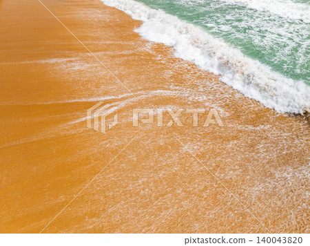 Bird eye view photo of beach sand background Bird eye view photo of beach sand background 140043820