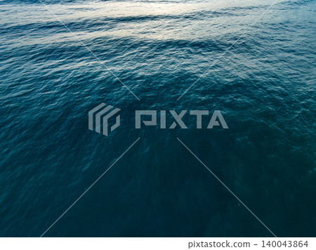 Sea surface aerial view,Bird eye view photo of blue waves and water surface texture Blue sea background Beautiful nature Amazing view sea background 140043864