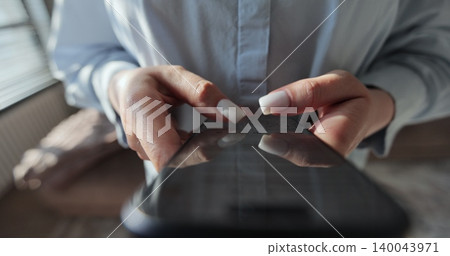 Young woman confident using smartphone. Smartphone browsing internet, searching, reading news in social media. 140043971