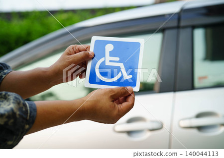 Wheelchair sticker sign on car for safety travel. Wheelchair sticker sign on car for safety travel. 140044113