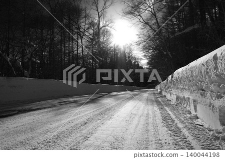 Driving on a snowy road in the daytime 140044198