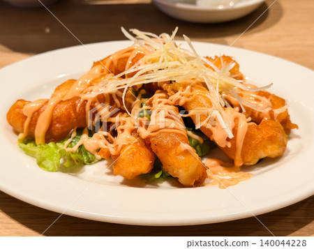 Shrimp with mayonnaise. A dish of fried shrimp topped with mayonnaise sauce. Shrimp with mayonnaise. A dish of fried shrimp topped with mayonnaise sauce. 140044228