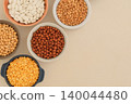 Protein products for vegetarians. Chickpeas in bowl. Various vegetarian organic products. Vitamins and antioxidants. Top view. 140044480