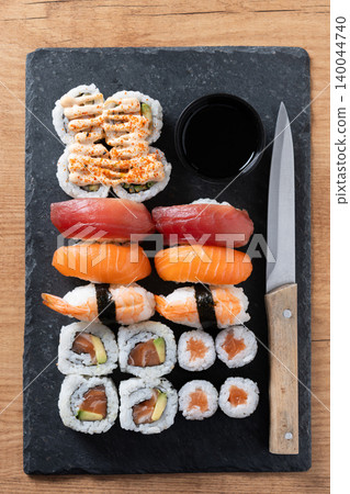 Assorted Sushi Selection and soy sauce on a Japanese restaurant table Assorted Sushi Selection and soy sauce on a Japanese restaurant table 140044740