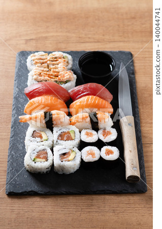 Assorted Sushi Selection and soy sauce on a Japanese restaurant table Assorted Sushi Selection and soy sauce on a Japanese restaurant table 140044741