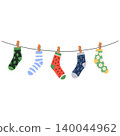 Socks on rope. Cotton or wool sock dry and hang on laundry string with clothespins. Children socks with textures and patterns vector cartoon. 140044962