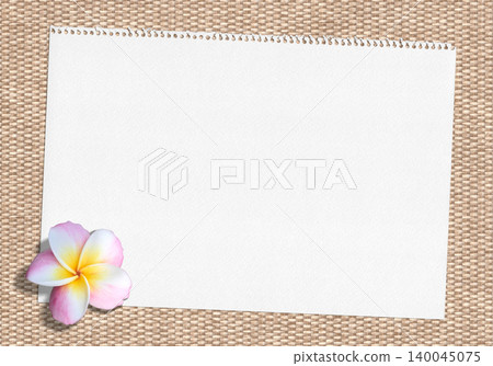 Natural materials and a sketchbook, with a background of pink plumeria. Natural materials and a sketchbook, with a background of pink plumeria. 140045075