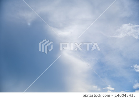 Cloudscape with clouds covering the sun under the blue sky. Nature scene, skyscape and cloudscape. 140045433