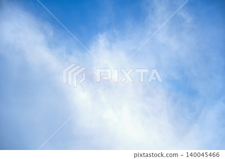 Rainbow in the clouds with the blue sky in the background. Cloudscape, skyscape, nature concept. Rainbow in the clouds with the blue sky in the background. Cloudscape, skyscape, nature concept. 140045466