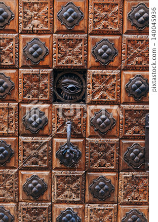Traditional carved Venetian wooden door with antique decorative details Traditional carved Venetian wooden door with antique decorative details 140045936