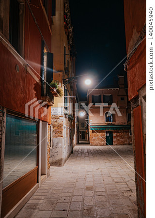 Empty Venice street at night with soft lights and historic architecture Empty Venice street at night with soft lights and historic architecture 140045940