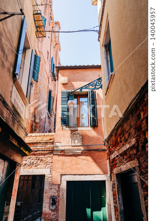 Historic Narrow Venice street without people, classic Italian architecture Historic Narrow Venice street without people, classic Italian architecture 140045957