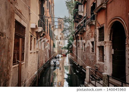 Sunny Venetian Canal With Traditional Stone Bridge and Old Buildings Sunny Venetian Canal With Traditional Stone Bridge and Old Buildings 140045960