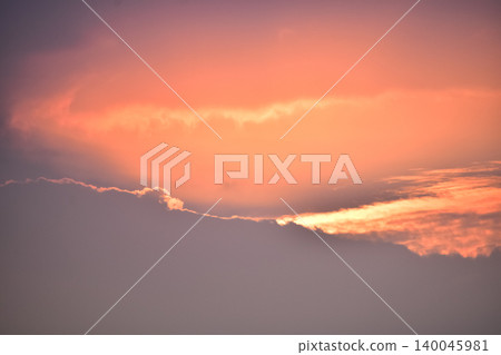 Dramatic colorful cloudscape with the sunbeam at the sunset. Sunlight through the clouds. Sunset skyscape, sunset background. Nature concept Dramatic colorful cloudscape with the sunbeam at the sunset. Sunlight through the clouds. Sunset skyscape, sunset background. Nature concept 140045981