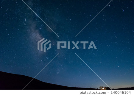 The Milky Way shining in the deep blue night sky and the lights of the Korobokkuru Hutte - Kirigamine, Meteor Shower The Milky Way shining in the deep blue night sky and the lights of the Korobokkuru Hutte - Kirigamine, Meteor Shower 140046104