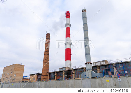 Industrial skyline scene. An industrial horizon with distinct chimney types and structural layers Industrial skyline scene. An industrial horizon with distinct chimney types and structural layers 140046168