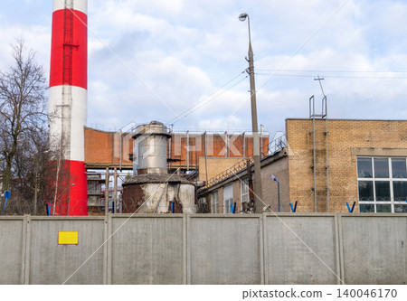 Detailed view of industrial piping and masonry. Close proximity shot of plant piping and wall surfaces Detailed view of industrial piping and masonry. Close proximity shot of plant piping and wall surfaces 140046170