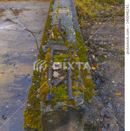Decay overtaking structure. Lush greenery and corrosion gradually take over neglected manmade frameworks 140046241
