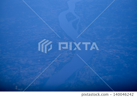 High angle view of the skyscape and cityscape. The view of Japan from the airplane window. Flying over Japan, Asia. Travel and nature scene. High angle view of the skyscape and cityscape. The view of Japan from the airplane window. Flying over Japan, Asia. Travel and nature scene. 140046242
