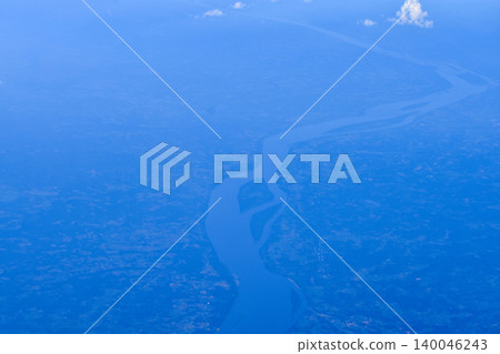 High angle view of the skyscape and cityscape. The view of Japan from the airplane window. Flying over Japan, Asia. Travel and nature scene. High angle view of the skyscape and cityscape. The view of Japan from the airplane window. Flying over Japan, Asia. Travel and nature scene. 140046243