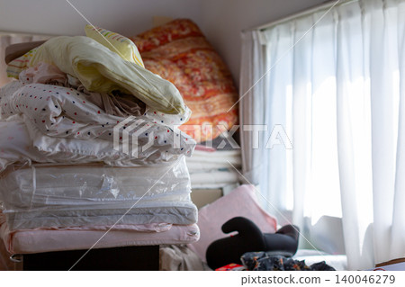 Decluttering, changing clothes for the season, organizing, bedding Decluttering, changing clothes for the season, organizing, bedding 140046279