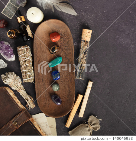 Leather Journal with Crystals, Sage, and Healing Stones on Dark Background 140046958