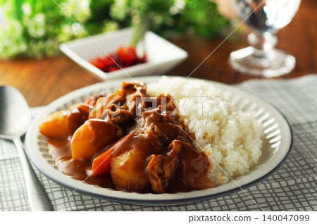 Beef curry with chunky vegetables 140047099