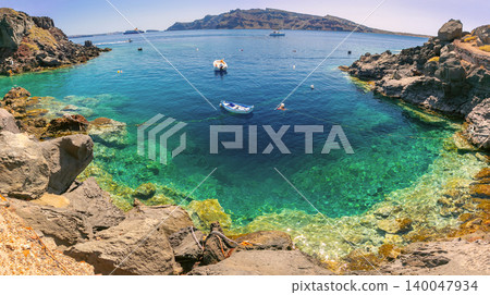 Volcanic cove with crystal clear water in Santorini caldera Greece Volcanic cove with crystal clear water in Santorini caldera Greece 140047934
