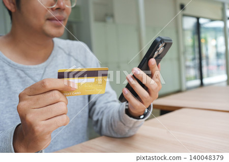 Credit card used for secure online shopping payment and mobile checkout. Credit card used for secure online shopping payment and mobile checkout. 140048379