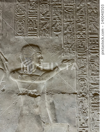 Beautiful bas-reliefs and ancient hieroglyphs in the Temple of Seti I in Abydos, Egypt. 140048503