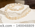 Natural stone pearl jewelry arrangements on display for customers 140048809