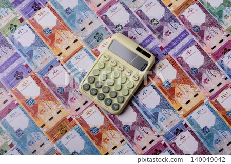 Qatar, Qatari riyal paper money and coins, financing and commodity exchange, trade. Qatari currency Qatar, Qatari riyal paper money and coins, financing and commodity exchange, trade. Qatari currency 140049042