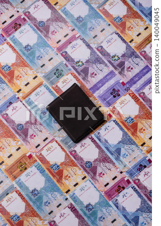 Qatar, Qatari riyal, paper money and coins, financing and commodity exchange, trade. Qatari currency Qatar, Qatari riyal, paper money and coins, financing and commodity exchange, trade. Qatari currency 140049045