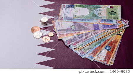 Qatar paper money, the Qatari riyal as a tool for financial transactions and trade. Qatari money Qatar paper money, the Qatari riyal as a tool for financial transactions and trade. Qatari money 140049080