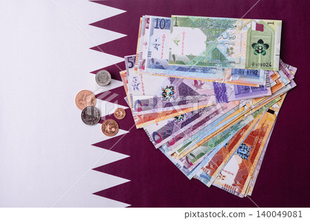 Qatar paper money, the Qatari riyal as a tool for financial transactions and trade. Qatari money Qatar paper money, the Qatari riyal as a tool for financial transactions and trade. Qatari money 140049081