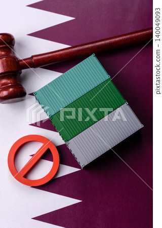 The cargo container ban on the Qatar flag as a conceptual backdrop. The cargo container embargo The cargo container ban on the Qatar flag as a conceptual backdrop. The cargo container embargo 140049093