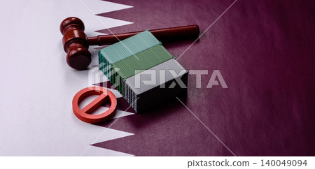 The cargo container ban on the Qatar flag as a conceptual backdrop. The cargo container embargo The cargo container ban on the Qatar flag as a conceptual backdrop. The cargo container embargo 140049094