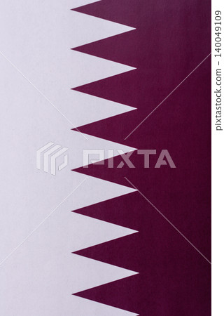 Qatar, the Qatari flag as a symbol of national independence. The Qatari flag Qatar, the Qatari flag as a symbol of national independence. The Qatari flag 140049109